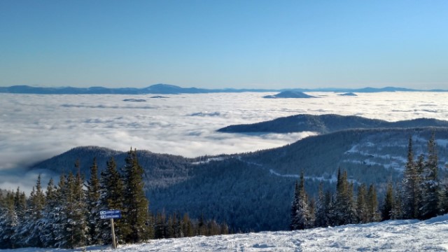 view from a ski hill above the clouds